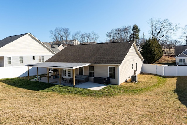 back of property with a patio, central AC unit, a lawn, and a fenced backyard