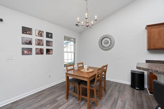 dining room with baseboards, dark wood-type flooring, and vaulted ceiling