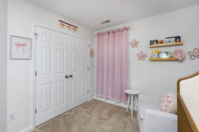 living area with carpet flooring and visible vents