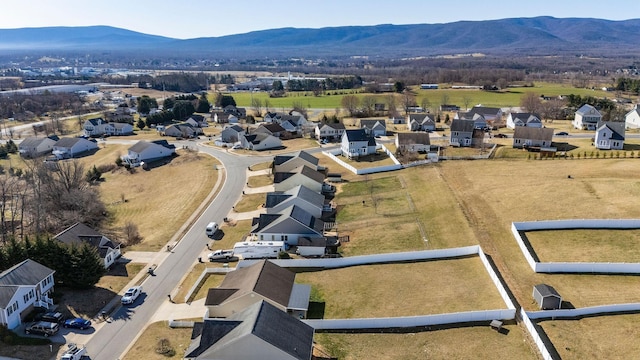 birds eye view of property featuring a mountain view and a residential view