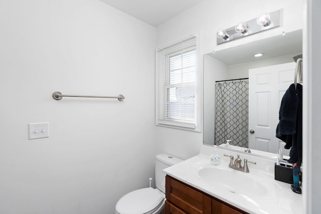 bathroom with vanity, toilet, and a shower with curtain