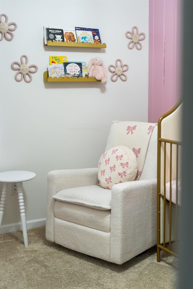 sitting room with carpet flooring and baseboards