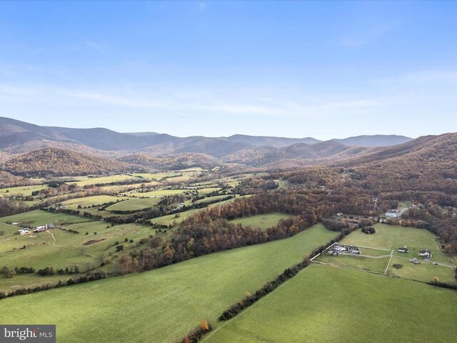 birds eye view of property with a mountain view