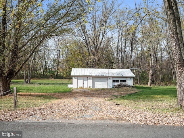 garage featuring a yard