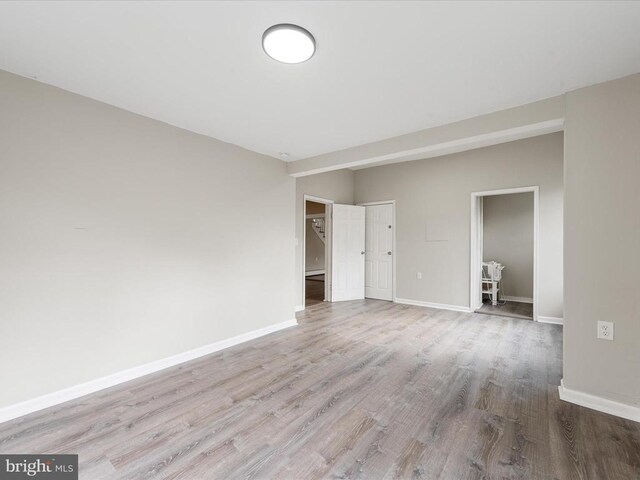 spare room with light hardwood / wood-style flooring