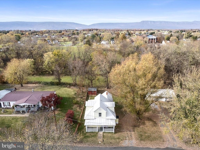 birds eye view of property featuring a mountain view