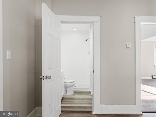 corridor featuring hardwood / wood-style flooring