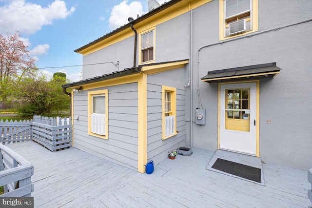 entrance to property with a deck