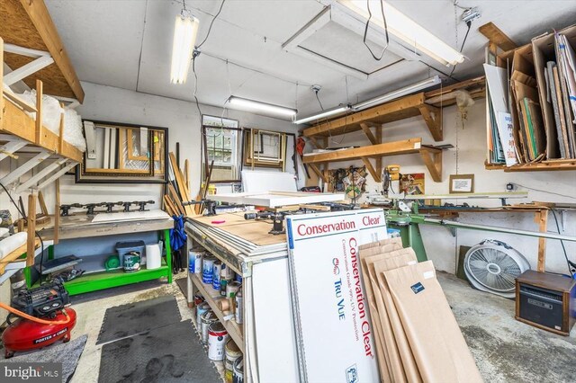 interior space with a workshop area and concrete floors