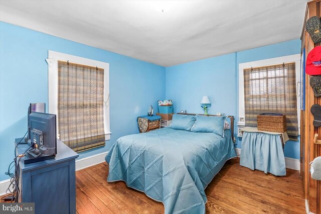 bedroom with wood-type flooring