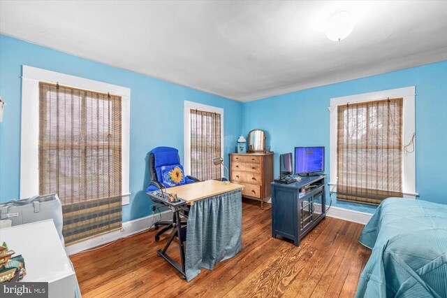 home office featuring dark hardwood / wood-style flooring