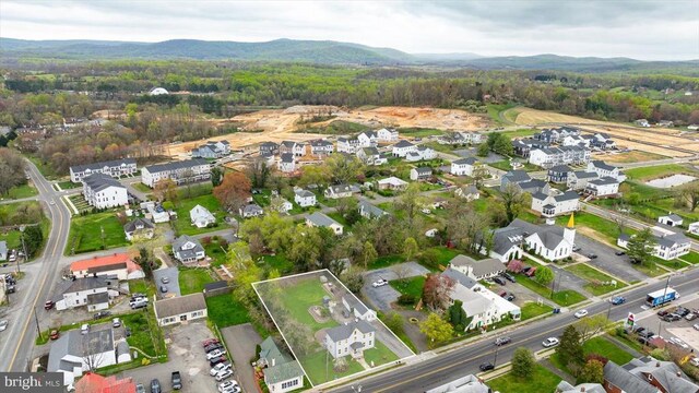 birds eye view of property featuring a mountain view