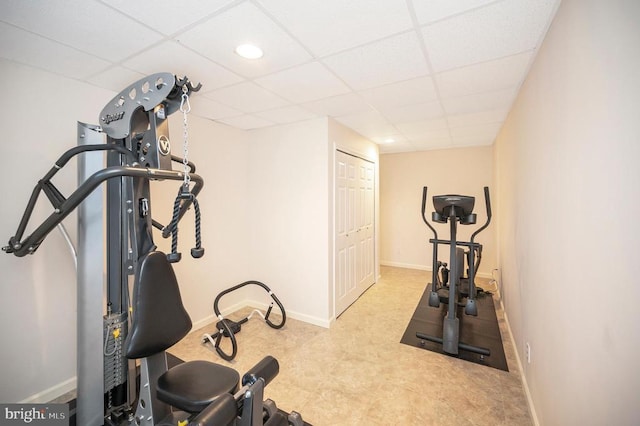 workout room featuring a drop ceiling