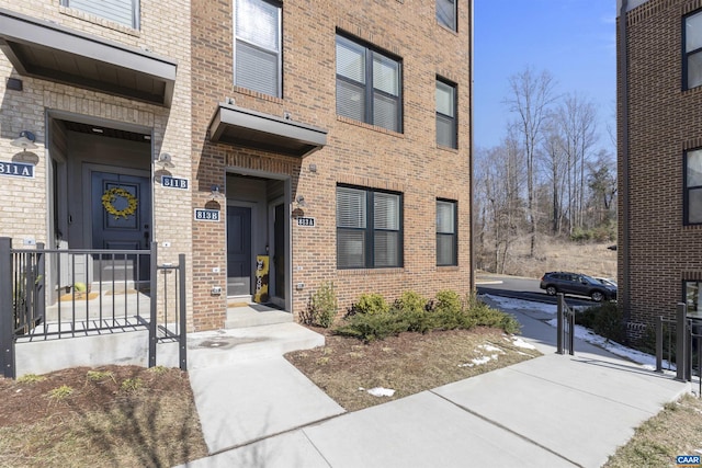 property entrance with brick siding