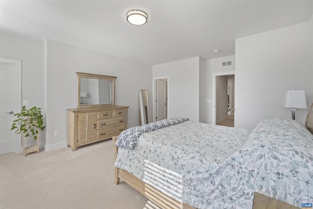 bedroom with baseboards, visible vents, and light colored carpet