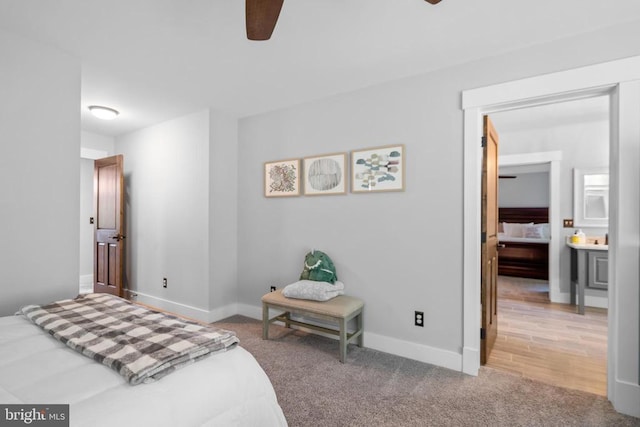 bedroom featuring ceiling fan and light carpet