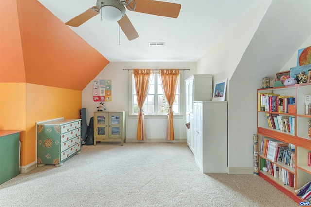 rec room with visible vents, lofted ceiling, carpet floors, baseboards, and ceiling fan