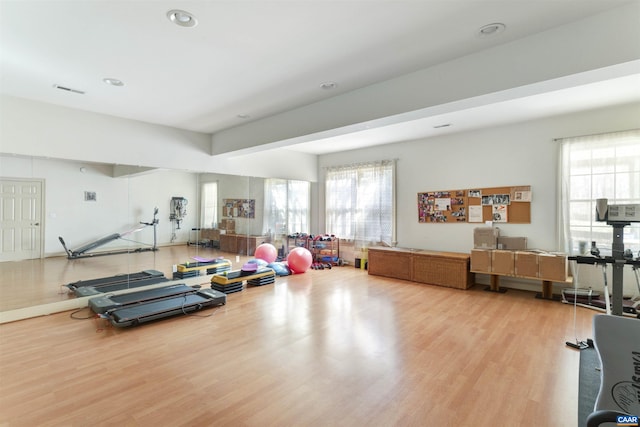 exercise area with recessed lighting and wood finished floors