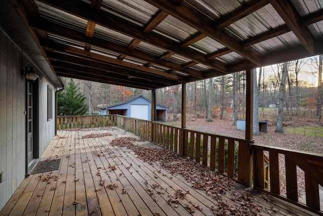wooden terrace with an outbuilding