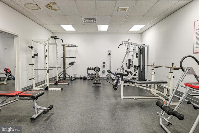 gym featuring a drop ceiling