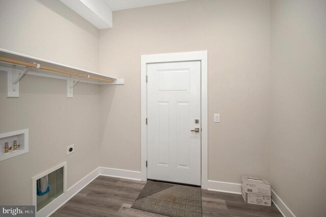 laundry room with dark wood-type flooring, washer hookup, and hookup for an electric dryer