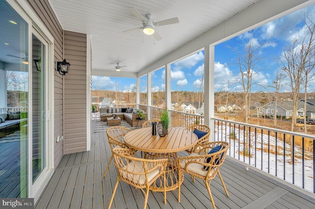 sunroom / solarium with ceiling fan