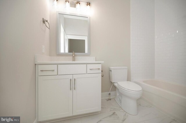 full bathroom featuring tiled shower / bath, vanity, and toilet