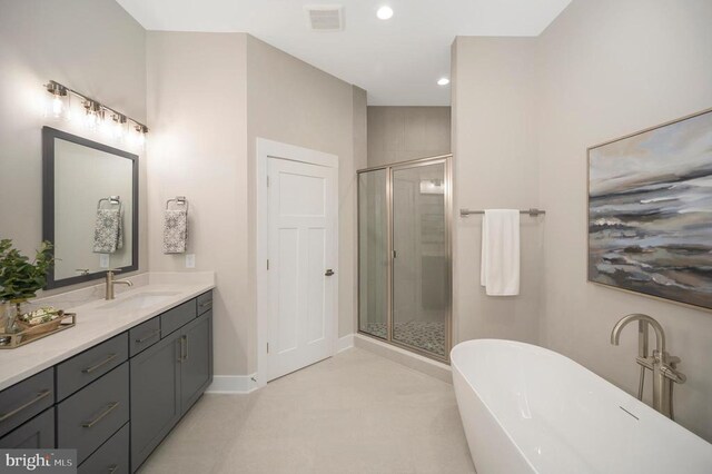 bathroom featuring independent shower and bath and vanity