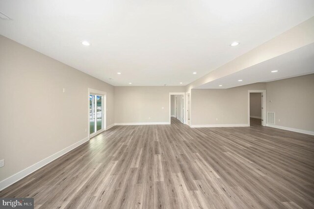 unfurnished living room featuring light wood-type flooring