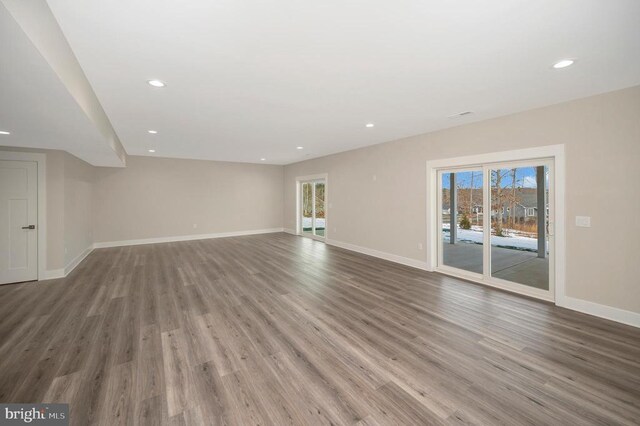 unfurnished living room featuring wood-type flooring