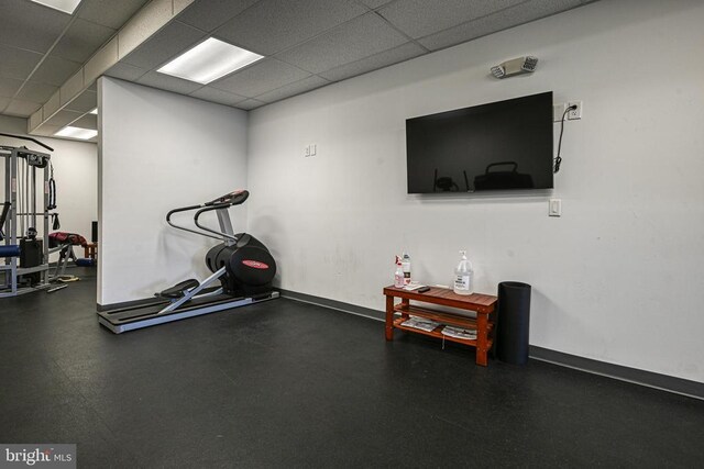 exercise room featuring a drop ceiling