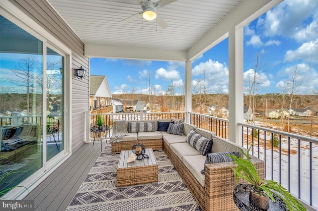 exterior space with ceiling fan and an outdoor living space