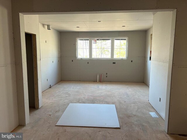 unfurnished living room featuring plenty of natural light