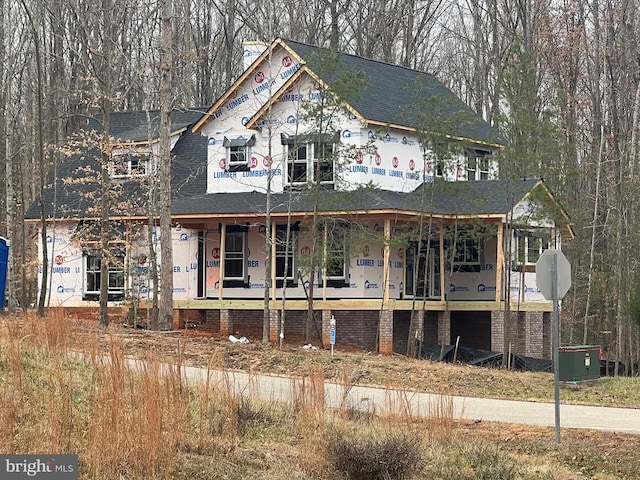 property in mid-construction featuring a porch