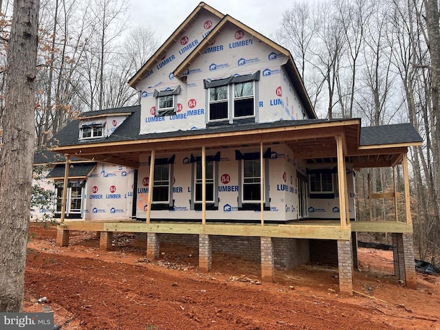 property in mid-construction featuring covered porch