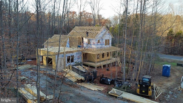 exterior space featuring a forest view