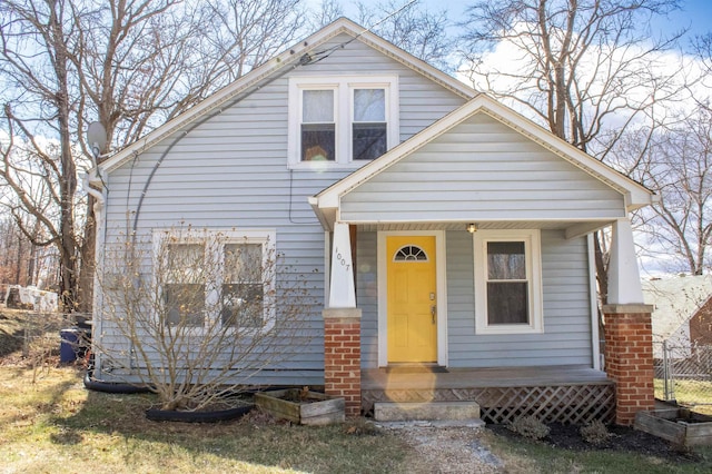 view of front of property featuring fence