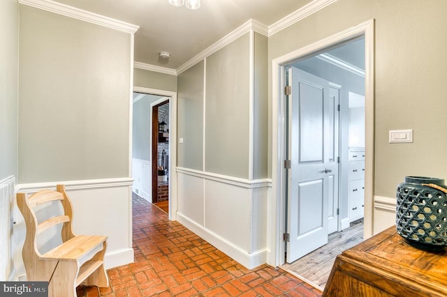 corridor with brick floor and ornamental molding