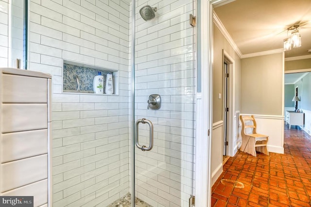 full bath with a stall shower, crown molding, and brick floor