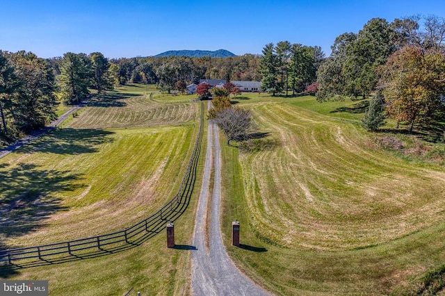 drone / aerial view with a mountain view and a rural view