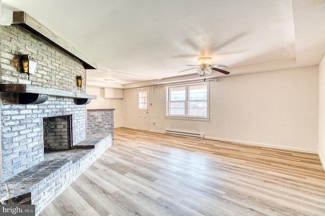 unfurnished living room featuring wood finished floors, baseboards, a baseboard radiator, a fireplace, and ceiling fan