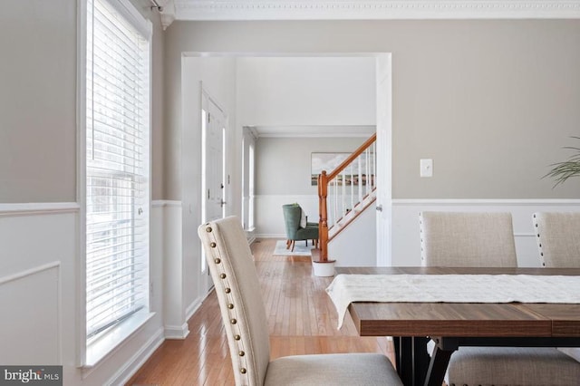 interior space with stairway, hardwood / wood-style floors, and crown molding