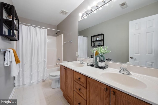 full bath with toilet, visible vents, and a sink