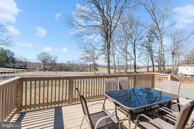 wooden deck with outdoor dining space