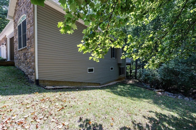 view of home's exterior featuring a yard