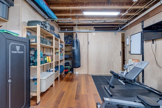 workout area with hardwood / wood-style floors