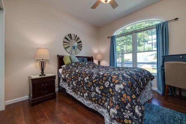 bedroom featuring dark wood-type flooring and ceiling fan