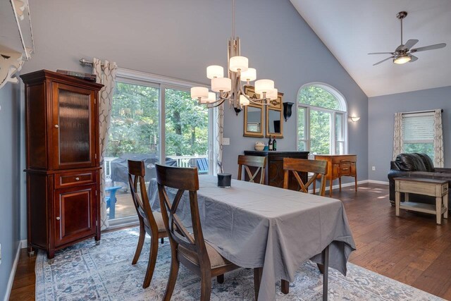 dining area featuring ceiling fan, high vaulted ceiling, and hardwood / wood-style floors