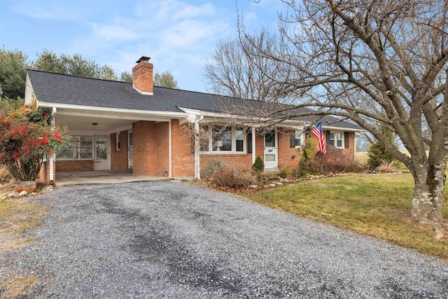 single story home with a carport and a front yard