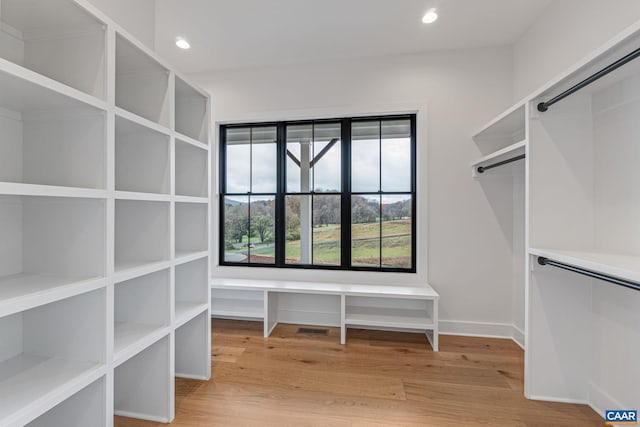 spacious closet featuring light wood-style floors and visible vents